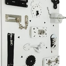 Montessori Learning Toy. Large white board with various interactive fixings such as locks, zips and switches.