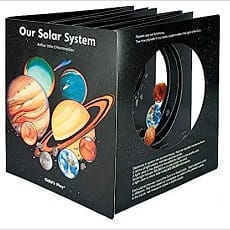 Black set of books about the solar system, "Our Solar System" written on the side.