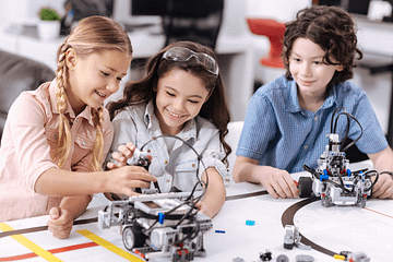 kids with a selection of toys for their age group