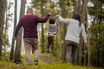 Playful parents and child representing KidMania's toy community