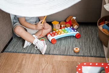 Child playing with xylophone