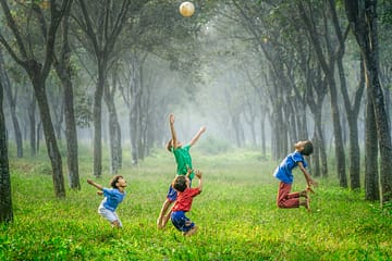 children having fun in the rain